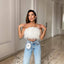 Yara | Blusa sofisticada adornada con plumas