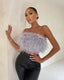 Yara | Blusa sofisticada adornada con plumas